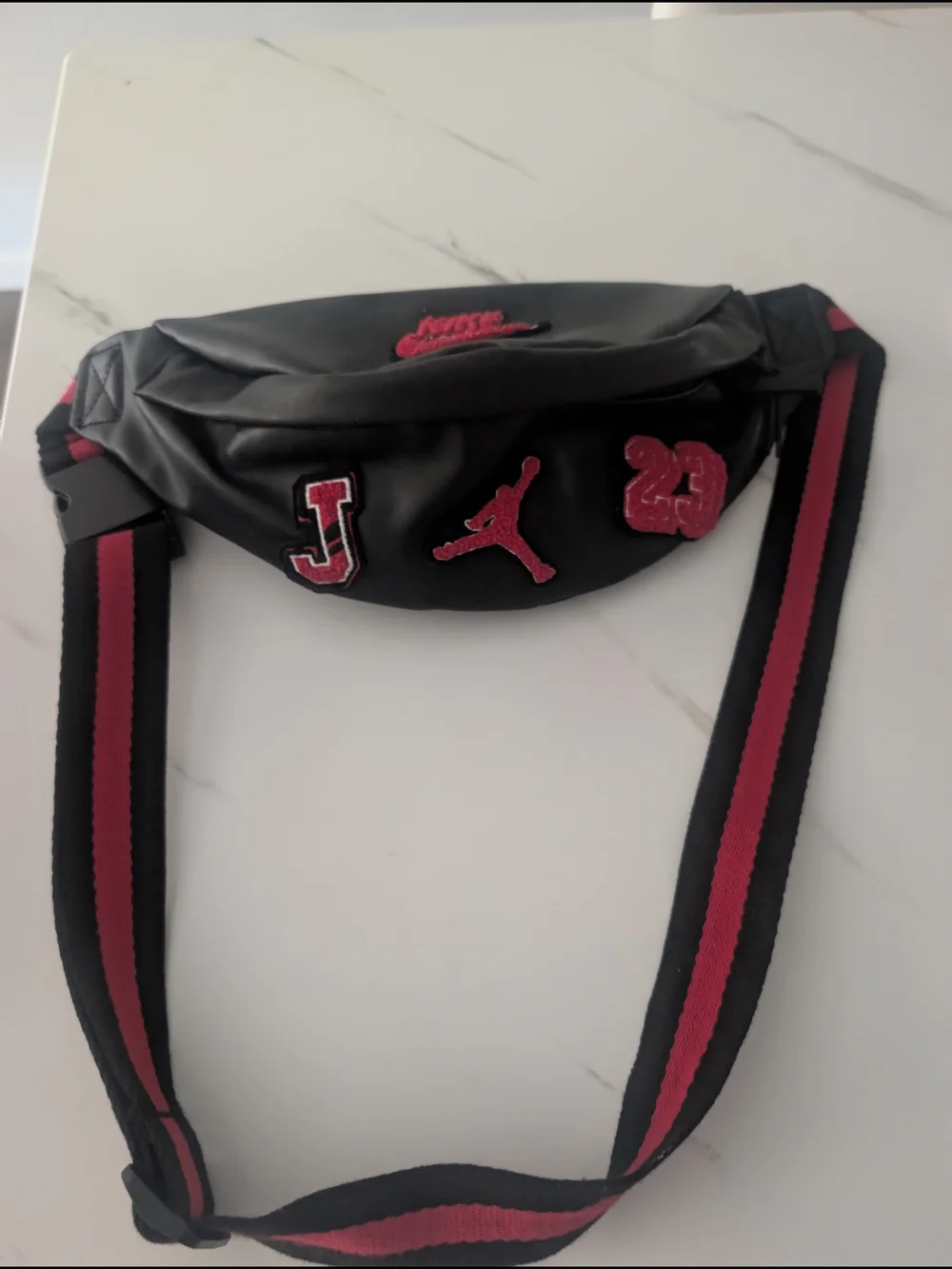 Nike Black Sling Bag with Red Logo Patch